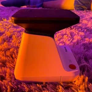 This is a Polaroid Lab. It can print out photos from your phone!